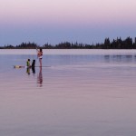 A dog, a boy, a paddler....